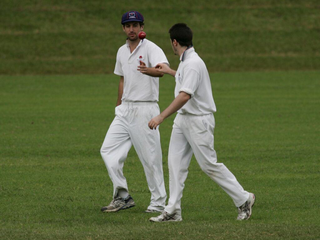 Adam walter offering encouragement to Ben McNamara on his way to match figures of 9 for 71