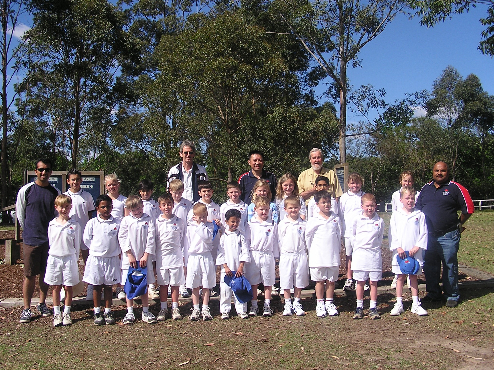 Our 18 Kanga children and mentors arriving for the all day shoot (8.00 am to 4.00 pm) for a Milo TV ad with Netball star Lis Ellis. Our parents are - Raj Babla, Myles O'Meara, Patrick Chensee, John Coulthard, Deepak Narsai - Turramurra Oval on 19 October 2004.